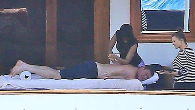Billionaire James Packer enjoys a massage on the deck of his luxury yacht in Spain
