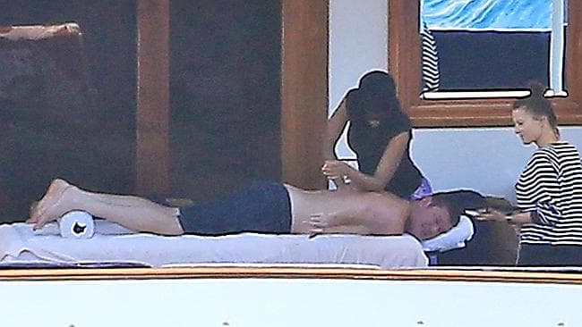 Billionaire James Packer enjoys a massage on the deck of his luxury yacht in Spain